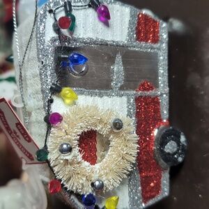 AVAILABLE - Vintage Camper with Holiday wreath and lights with splash of snow.